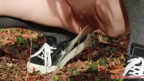 Teen brunette jerks off in woods after taking off sneakers