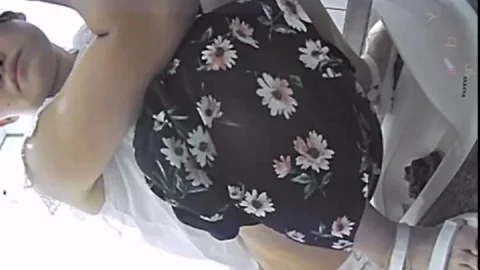 Asian Woman Urinates in Bathroom