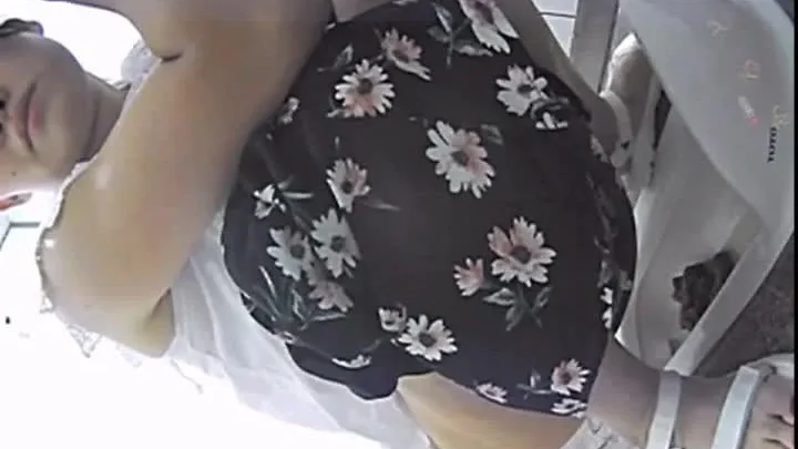 Asian Woman Urinates in Bathroom