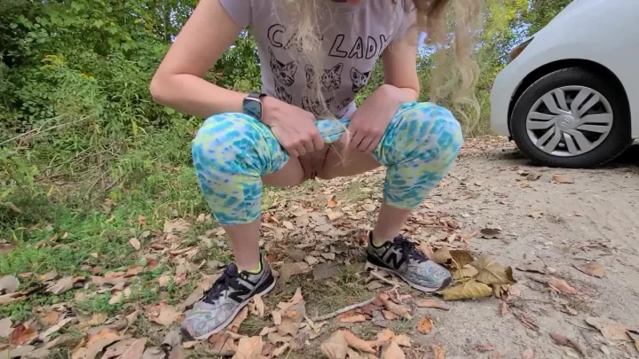 Blonde in forest exposes herself on dirt road near car