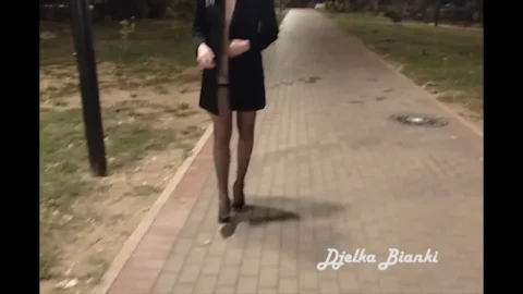 Blonde walks topless through park at night, later meets guy on bench
