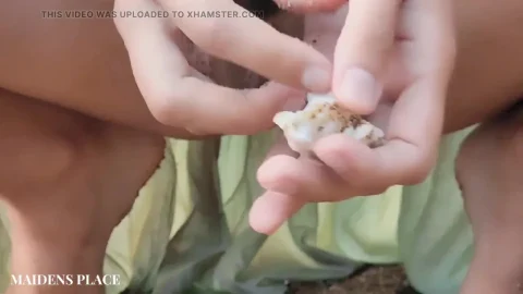 Pissing on a Beach Shell Close Up