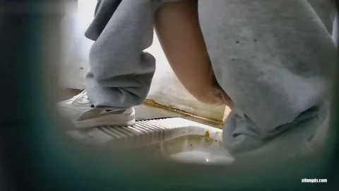 Several Young Women in Sneakers Bathroom Fun