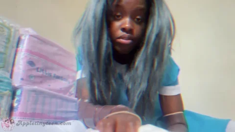 Black teen in blue hair gets diaper changed in bedroom POV