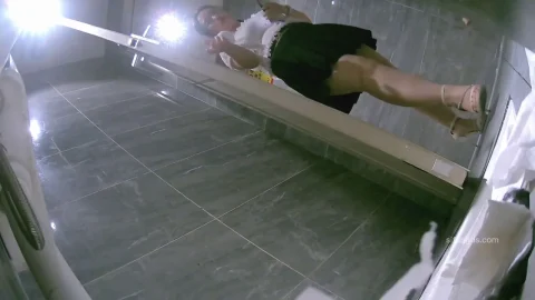 Asian Woman with Tattoos and Heels Performs Intimate Acts