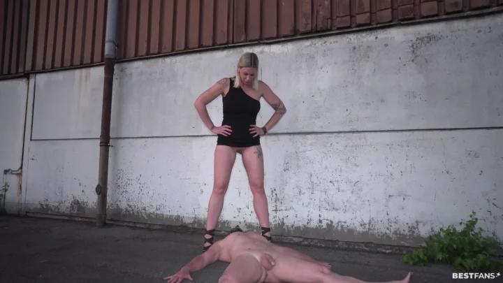 Two blondes in heels dominate a guy in an alley on camera