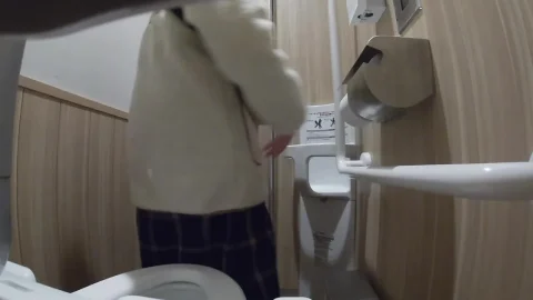 East Asian Woman Exposed Buttocks in Bathroom