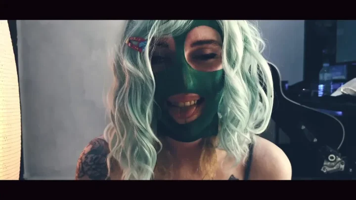 Slim blonde with green tattoos jerking off with green dildo in bed