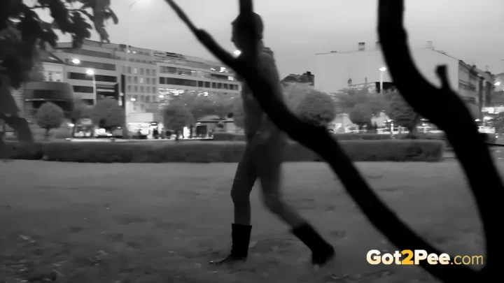 Blonde in parking garage & woods – urinating, outdoor scene