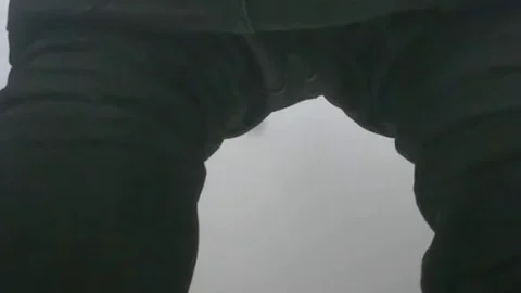 Asian guy bends over in bathroom showing off slim ass
