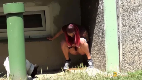 Redhead & brunette with bulldog licking pussy outdoors